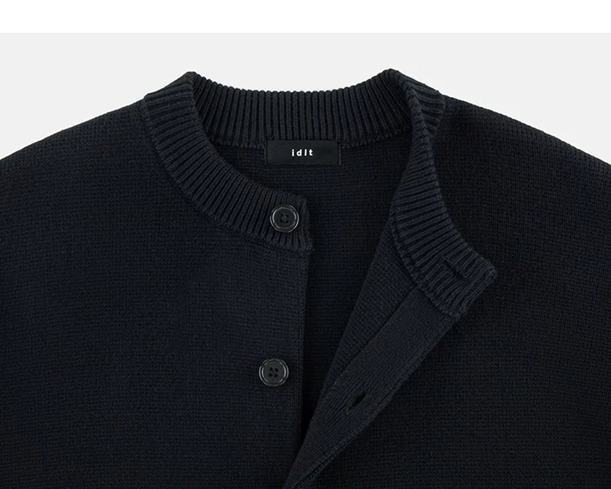 IDLT cardigan, black neckline and buttons.