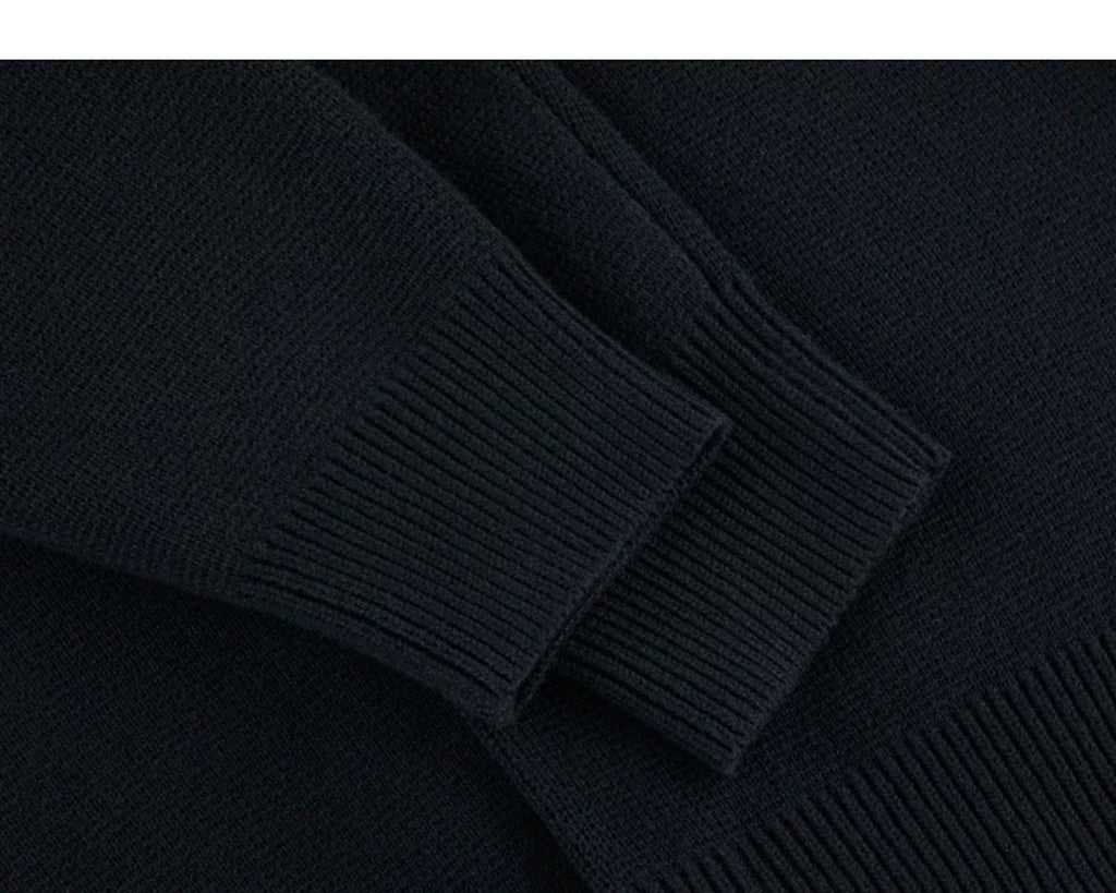 IDLT cardigan, black ribbed cuffs.