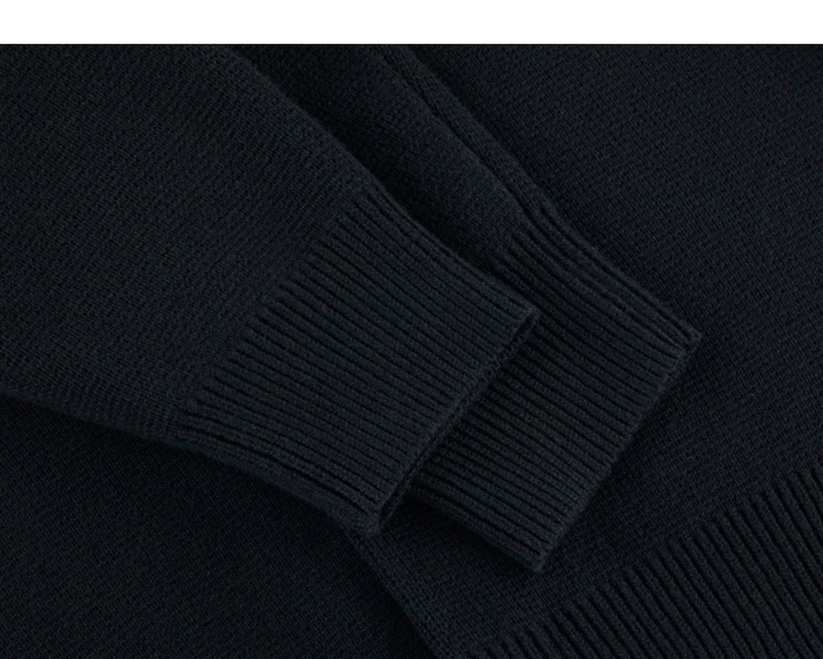 IDLT cardigan, black ribbed cuffs.
