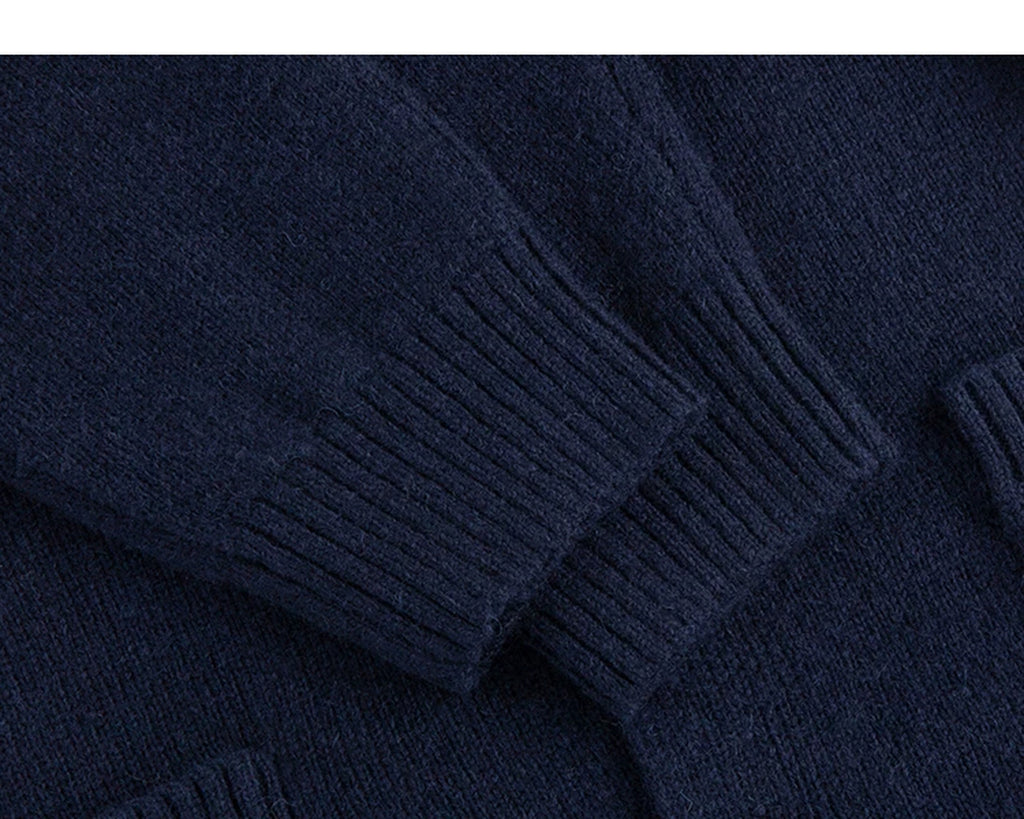 IDLT stand collar cardigan, navy ribbed cuffs.