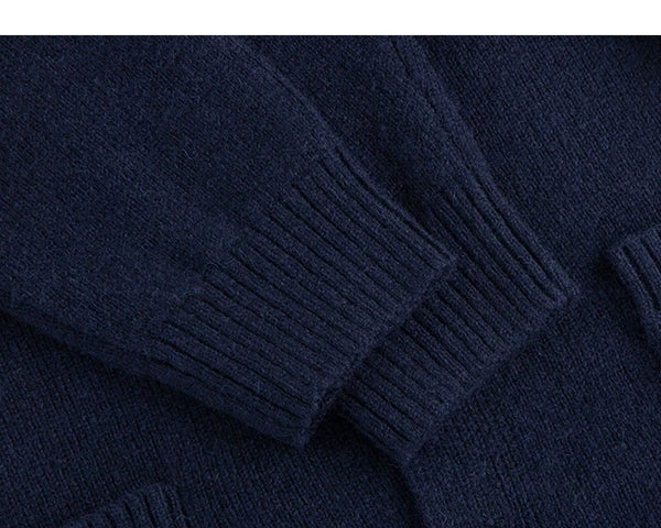 IDLT stand collar cardigan, navy ribbed cuffs.