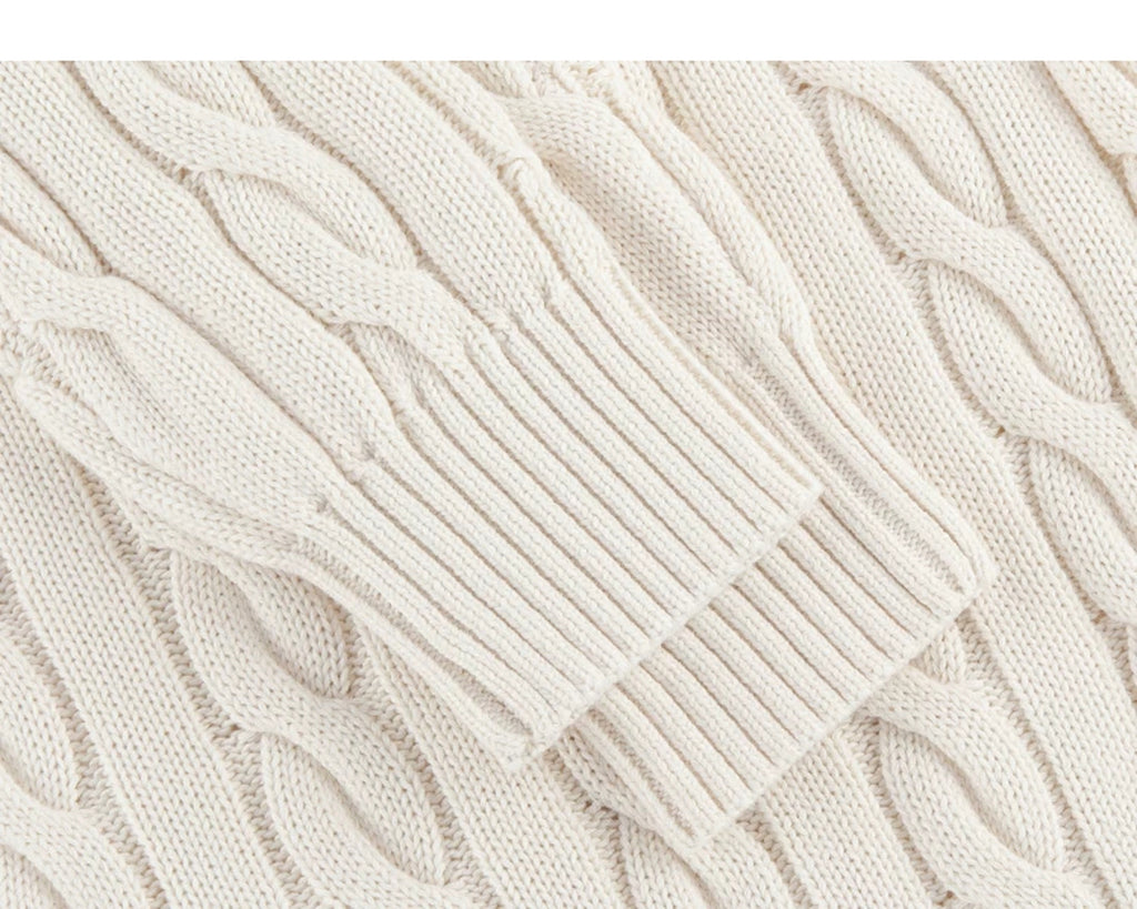 IDLT cable knit half zip sweater, cream ribbed cuffs.