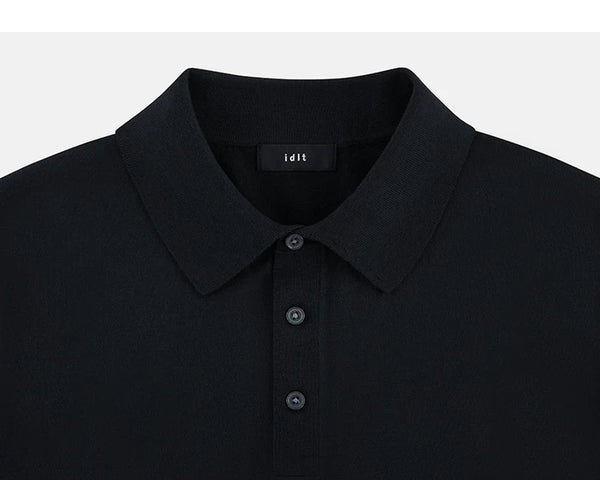 IDLT knit polo shirt, black collar and placket.