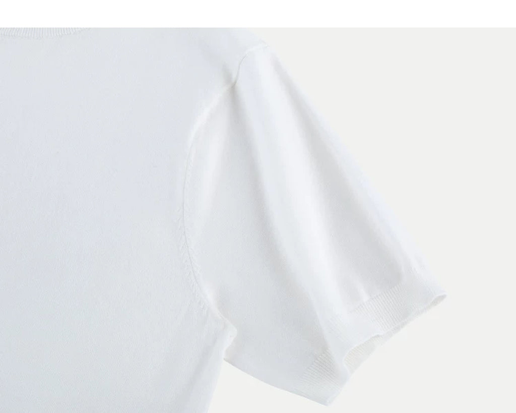 IDLT short sleeve knit top, white sleeve.
