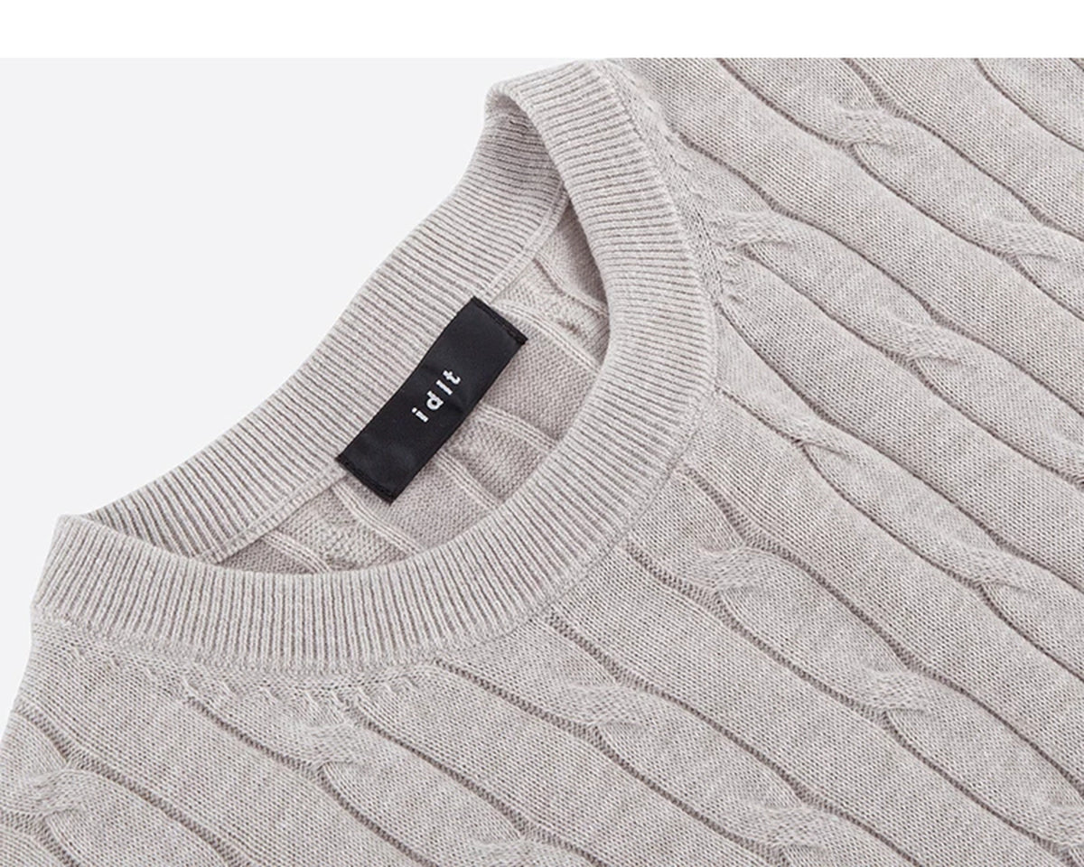 IDLT cable knit short sleeve sweater, beige angled neckline and label.
