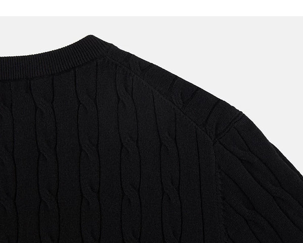 IDLT cable knit short sleeve sweater, black back shoulder.