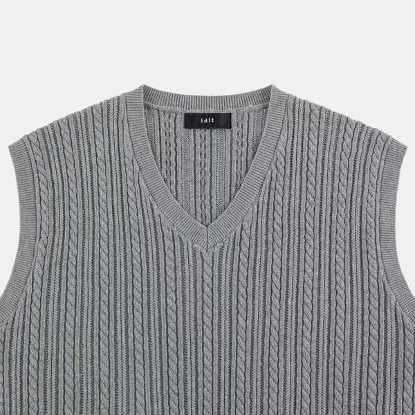 IDLT cable knit vest, gray V-neck close-up.