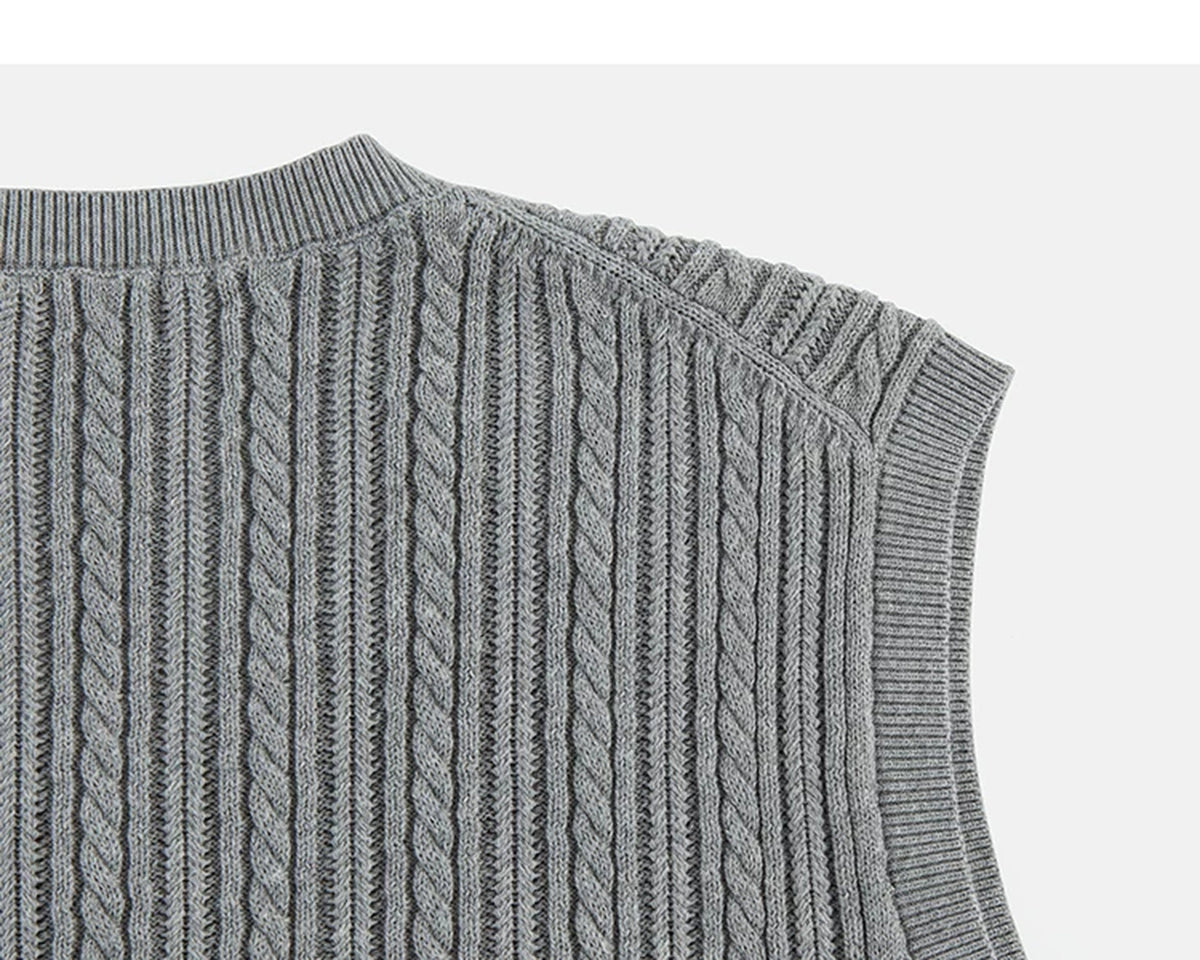 IDLT cable knit vest, gray back shoulder.