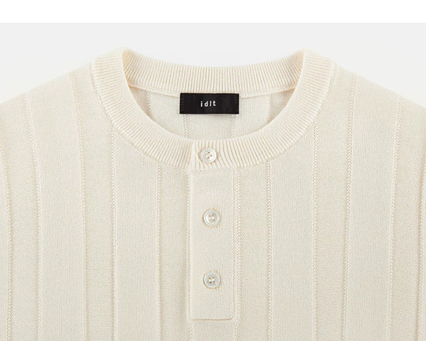 IDLT knit short sleeve henley, cream neckline and buttons.