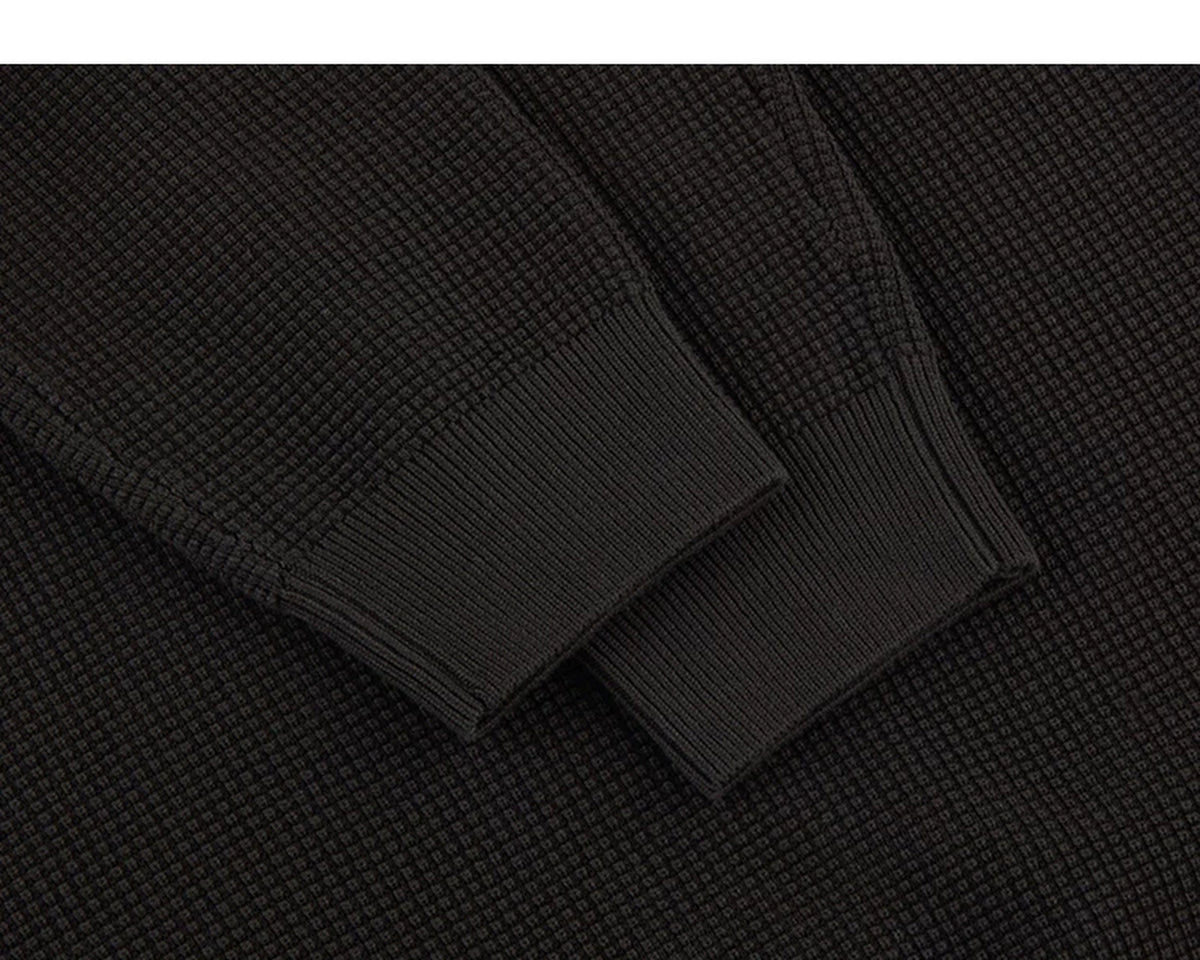 IDLT textured sweater, brown cuffs.
