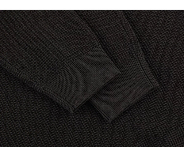 IDLT textured sweater, brown cuffs.