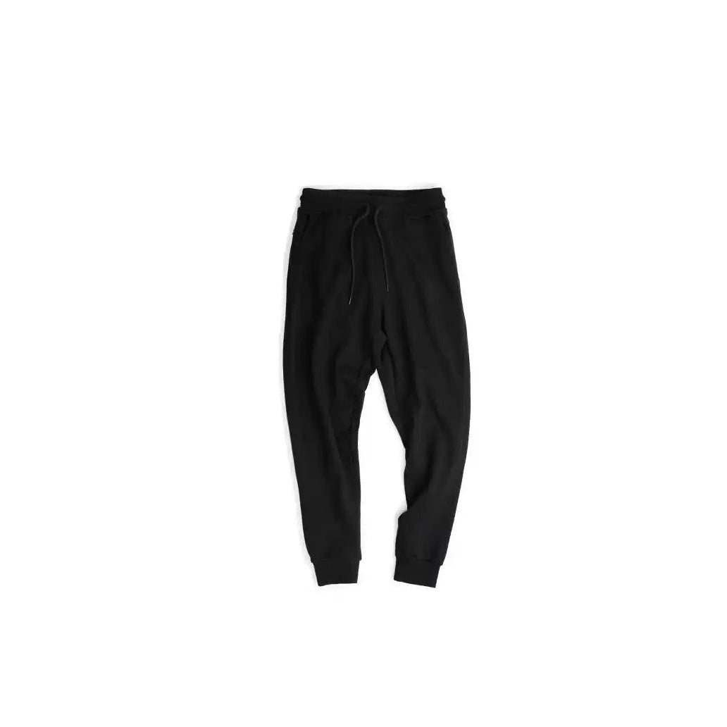 IDLT joggers, black laid flat.