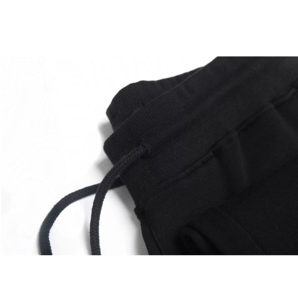 IDLT joggers, black drawstring waistband.