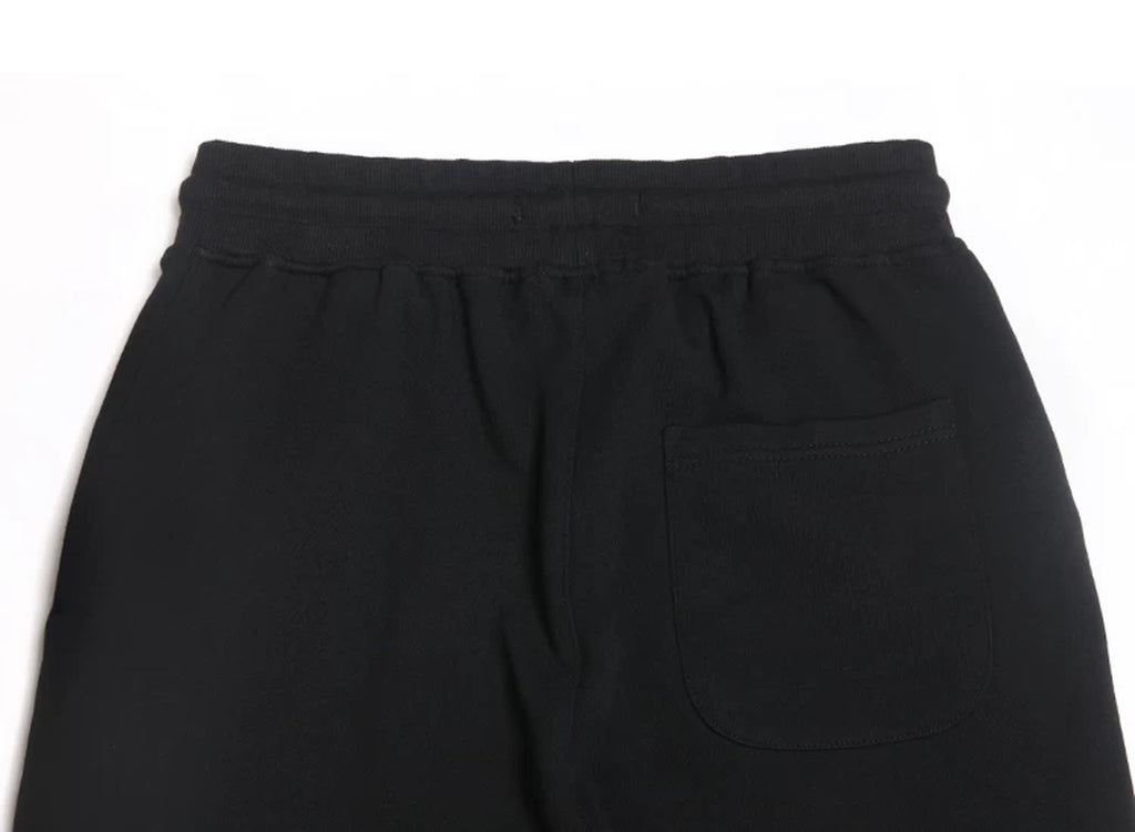IDLT joggers, black back pocket.
