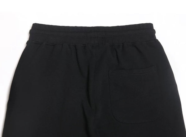 IDLT joggers, black back pocket.