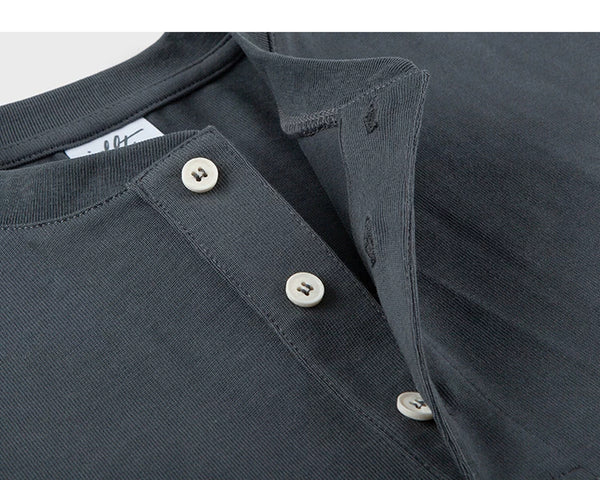 IDLT short sleeve henley, dark gray open button placket.