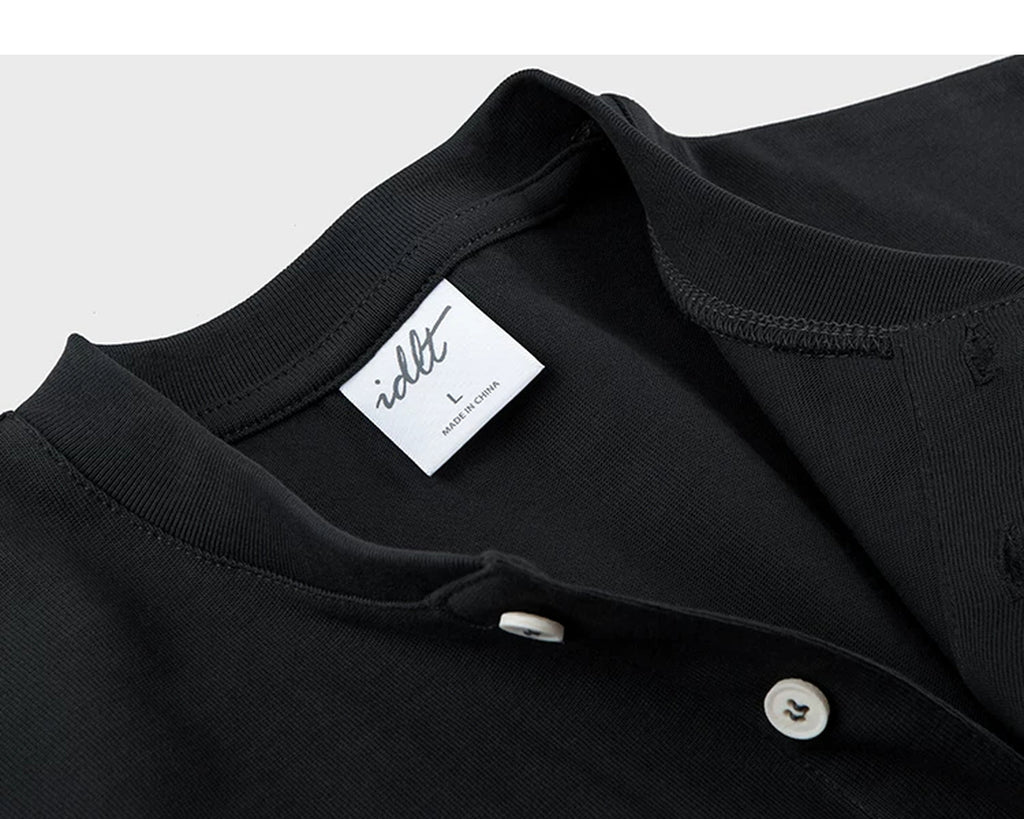 IDLT short sleeve henley, black neckline and label.