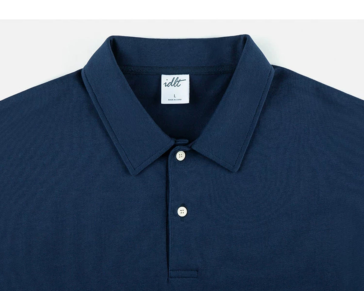 IDLT short sleeve polo, navy collar and buttons.