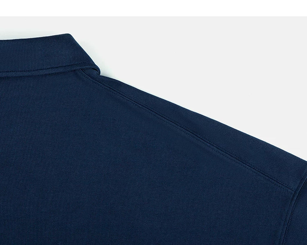 IDLT short sleeve polo, navy back shoulder seam.