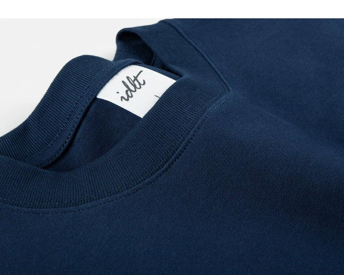 IDLT long sleeve pocket T-shirt, navy neckline and label.