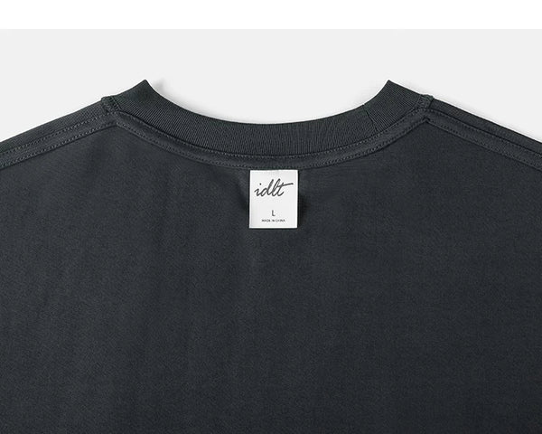 IDLT long sleeve pocket T-shirt, dark gray back neckline and label.