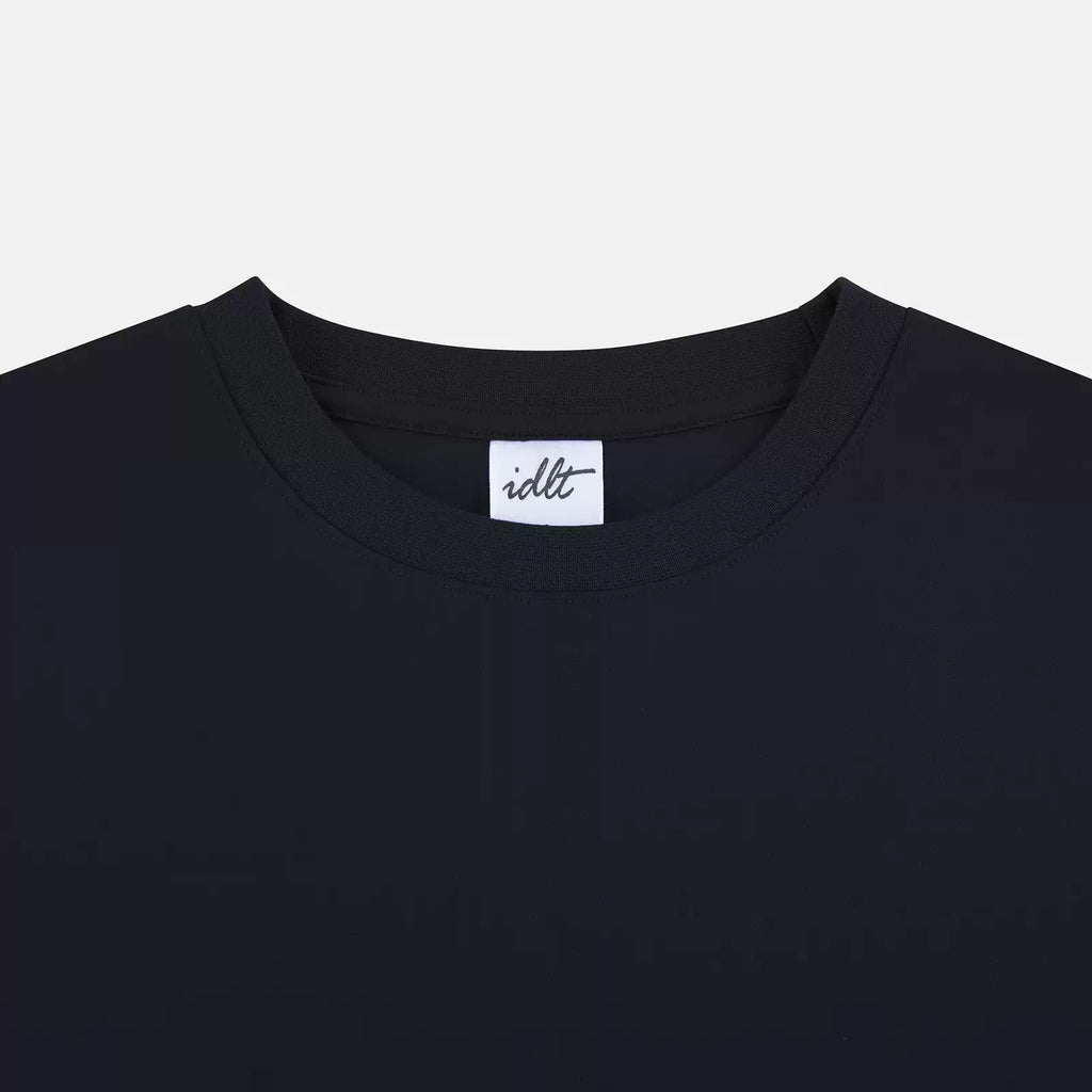 IDLT T-shirt, black neckline close-up.
