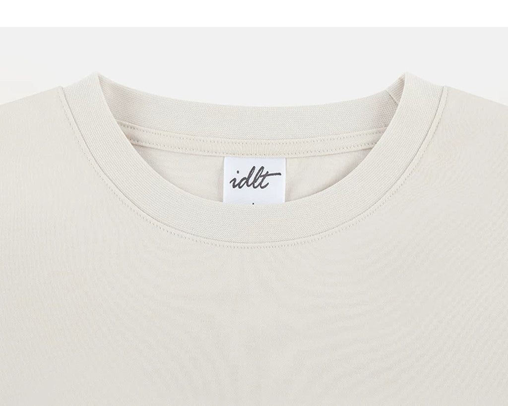 IDLT T-shirt, cream crewneck.