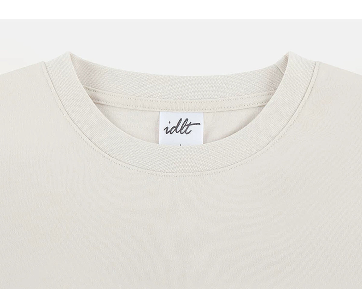 IDLT T-shirt, cream crewneck.