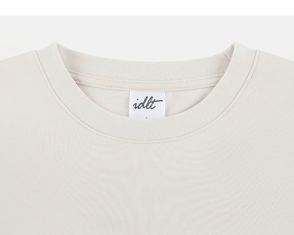 IDLT T-shirt, cream crewneck.